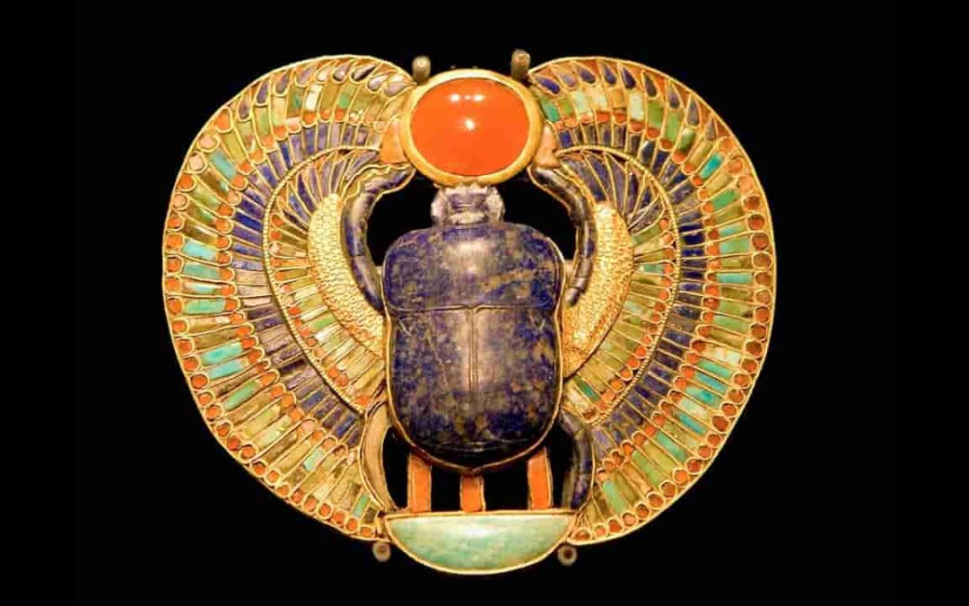 What does the scarab beetle symbolize in ancient Egypt?